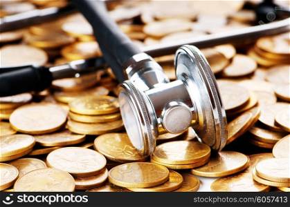 Concept of expensive healthcare with coins and stethoscope