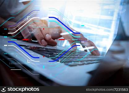 Concept of focus on target with digital diagram.business man hand working on laptop computer on wooden desk as concept, young man student typing on computer sitting at wooden table