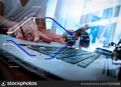 Concept of focus on target with digital diagram.business man hand working on laptop computer on wooden desk as concept, young man student typing on computer and using smart phone in the office