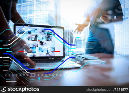 Concept of focus on target with digital diagram.double exposure of new modern laptop computer with businessman hand working and business strategy as concept