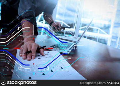 Concept of focus on target with digital diagram.business documents on office table with smart phone and laptop computer and graph business with social network diagram and man working in the background