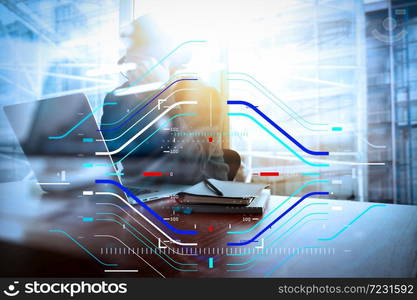 Concept of focus on target with digital diagram.Young creative designer man working at office with computer laptop as concept