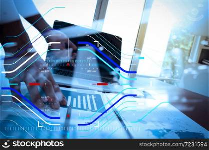 Concept of focus on target with digital diagram.double exposure of business documents on office table with laptop computer and man working in the background