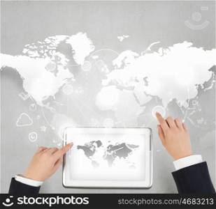 Concept of global business and connection. Businessman hands working on tablet with world map on screen