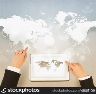Concept of global business and connection. Businessman hands working on tablet with world map on screen