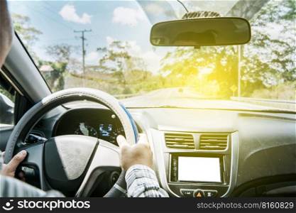 Concept of hands on the wheel of a car, Man’s hands on the wheel of the car, Close up of person driving with hands on the wheel, inside view of a man driving a car