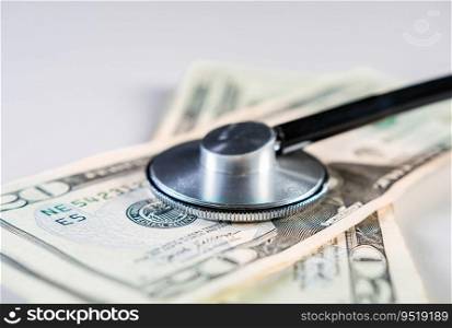 Concept of high cost of medical health. Stethoscope with money. Close up of medical stethoscope on dollar bills isolated