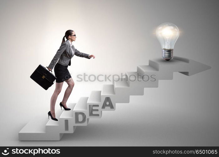 Concept of idea with businesswoman climbing steps stairs