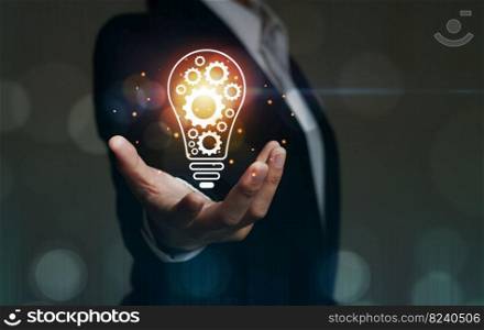 concept of innovative business technology Hand-held bulb for Concept, a new concept with innovation and inspiration, innovative business women in science and communication concepts.