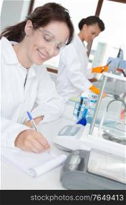 concept of laboratory technician taking notes