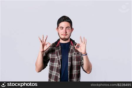 Concept of no problem, young man making ok gesture, expression of everything is fine.
