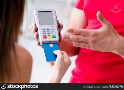 Concept of paying with POS terminal