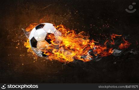 Concept of soccer game with ball in fire flames. Mixed media. Soccer Ball on Fire