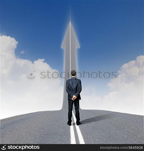 Concept of the road to success with a businessman standing on the road