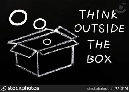 "Concept of "Think outside the box" drawn with chalk on a blackboard "
