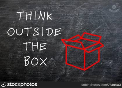 "Concept of "Think Outside the box" drawn with chalk on a smudged chalkboard "