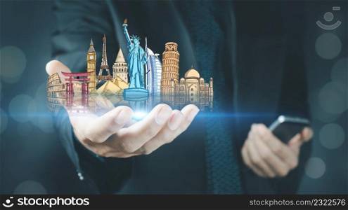 concept of travel .Business man holding wonders of the world, world tour 