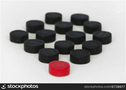 Concept of uniqueness and leadership with red and black checkers