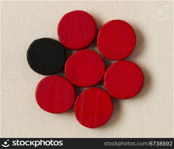 Concept of uniqueness and leadership with red and black checkers
