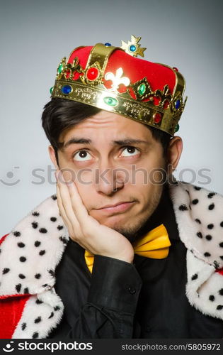 Concept with funny man wearing crown