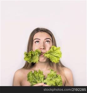 concept young woman eating fresh salad