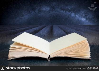 Conceptual composite open book image of Beautiful image of lavender field with Milky Way in lcear sky