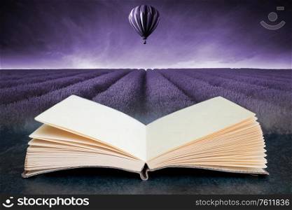 Conceptual composite open book image of Lavender field Summer sunset landscape with hot air balloon toned in monochrome