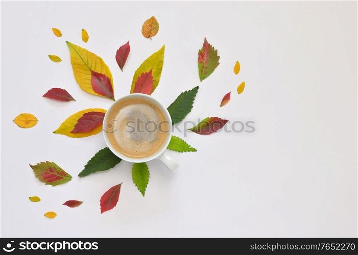 Conceptual Espresso Coffee Cup with Autumn Leaves