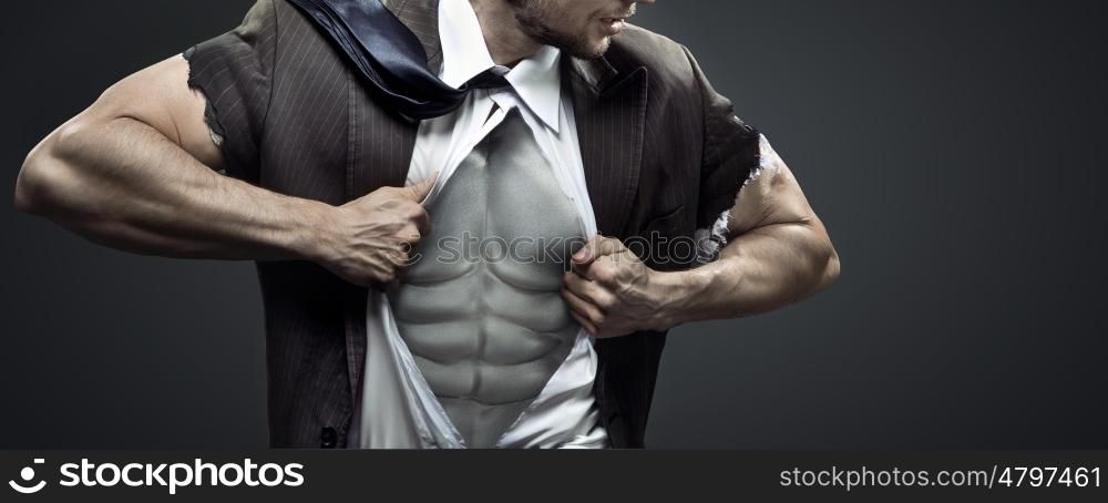Conceptual image of exhausted muscular businessman