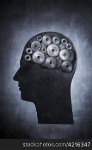 Conceptual image of head filled with cog gears.