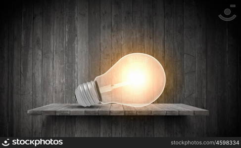 Conceptual image of light bulb on wall with sketches of ideas. Brigth ideas