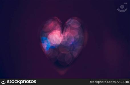 Conceptual Image of Love. Dark Purple Bokeh Style Heart. Abstract Holiday Background. Happy Valentine&rsquo;s Day. Greeting Card for Lovers.. Purple Heart Background