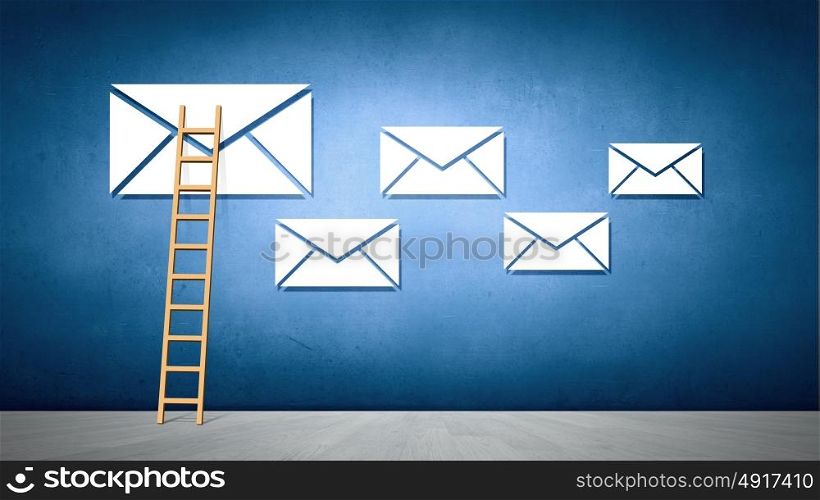 Conceptual image with ladder reaching email symbol