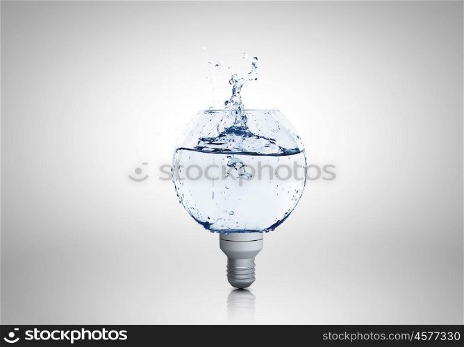 Conceptual image with light bulb filled with clear water. Light bulb with water