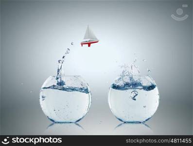 Conceptual image with two aquariums filled with clear water. Aquariums with water