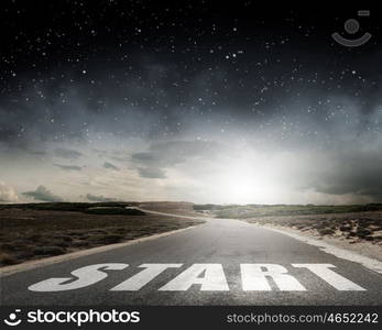 Conceptual image with word start on asphalt road. Start your way