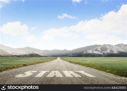 Conceptual image with word start on asphalt road. Start your way