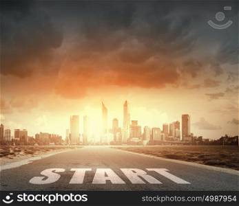 Conceptual image with word start on asphalt road. Start your way