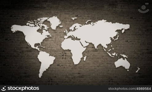 Conceptual image with world map on concrete wall. World map