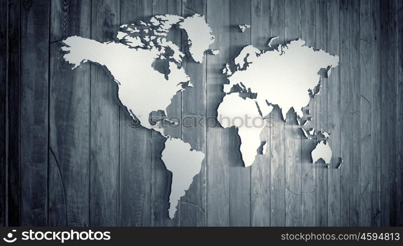 Conceptual image with world map on wooden wall. World map