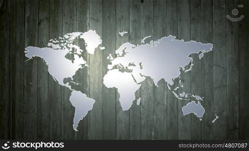Conceptual image with world map on wooden wall. World map