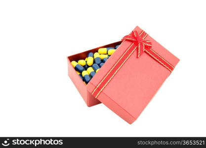 conceptual of capsule in red gift box