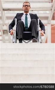 Conceptual photo of businessman on wheelchair in front of stairs
