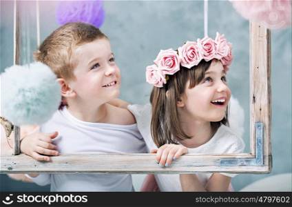 Conceptual photo of children holdng a photo frame