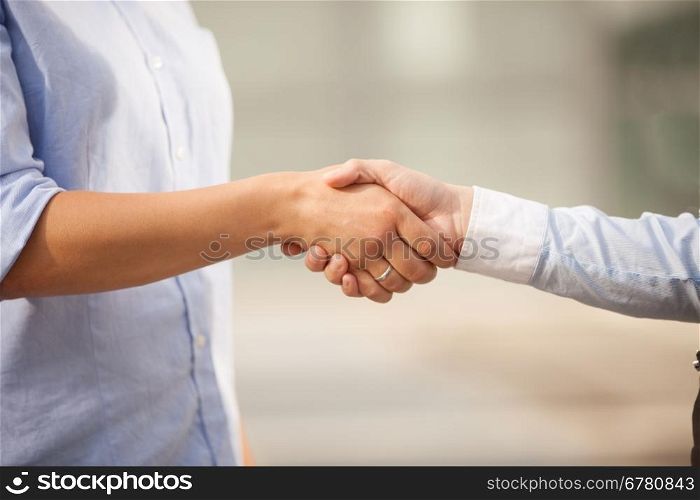 Conceptual photo of finding an agreement by shaking hands