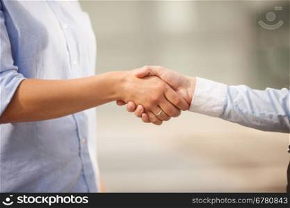 Conceptual photo of finding an agreement by shaking hands