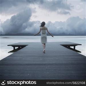 Conceptual photo of the lady on the pier