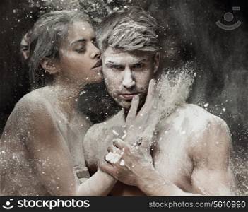 Conceptual photo of the young sand couple