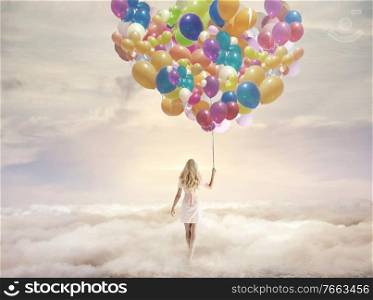 Conceptual picture of a woman holding hundreds of colorful balloons