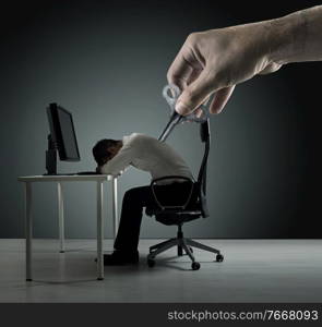 Conceptual picture of an exhausred office worker being winded up